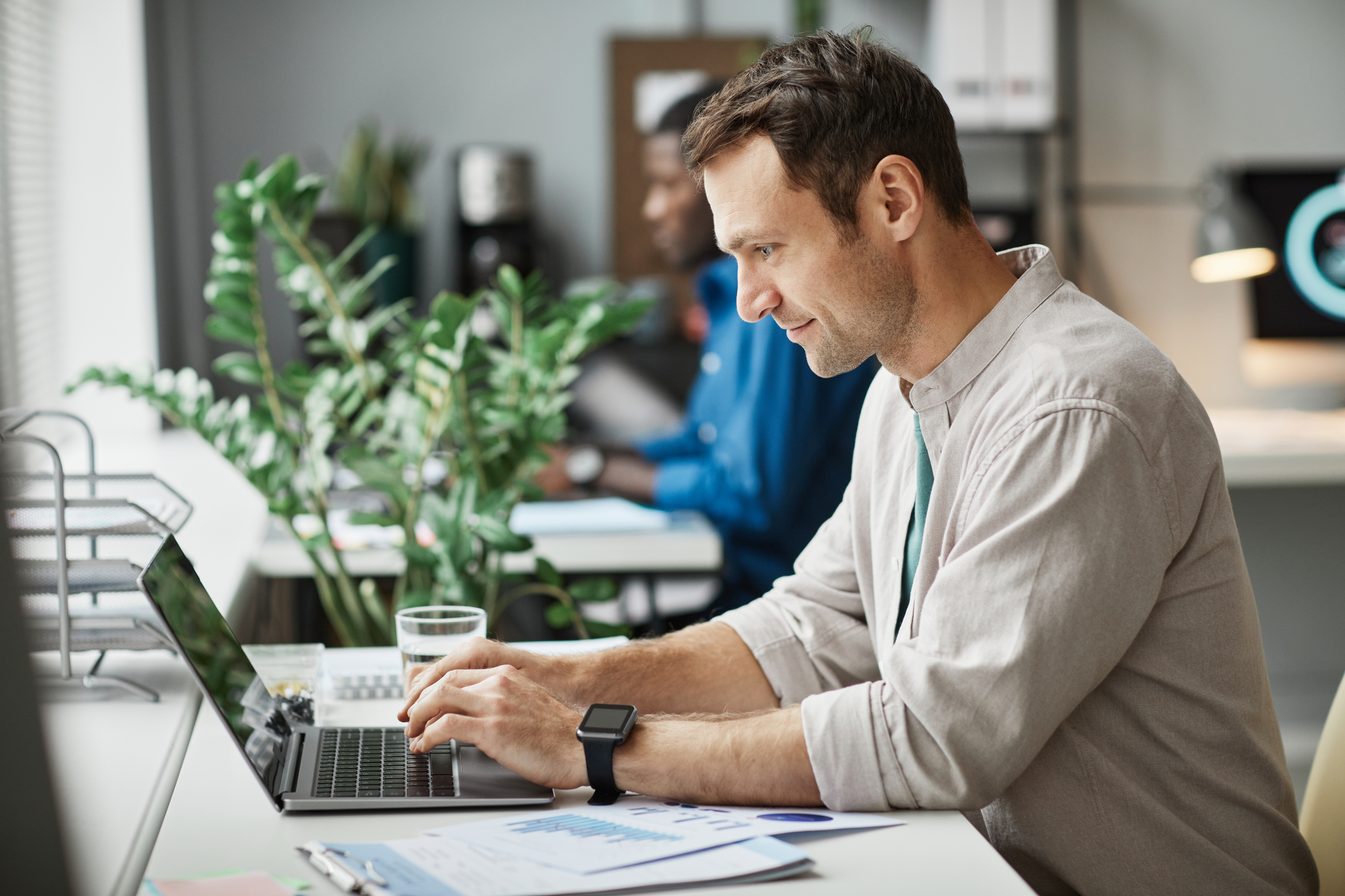 Man Working At Computer In Office Side View 2021 12 09 15 18 34 Utc