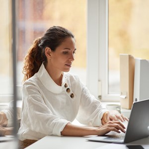 Successful Businesswoman Using Laptop By Window 2021 09 24 04 12 57 Utc