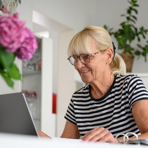 Happy Mature Woman Using Laptop In Living Room At 2023 11 27 05 19 15 Utc